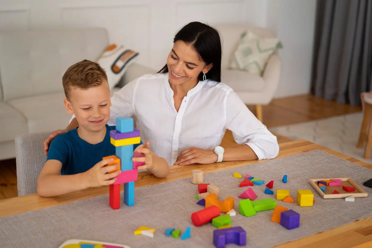 child with their mom playing brain teaser